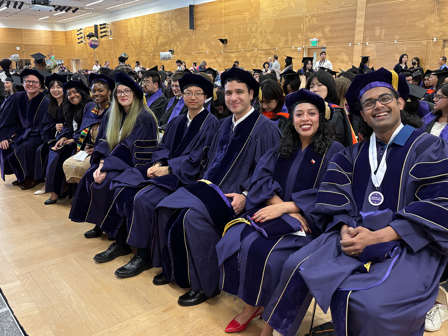 11 PhD graduates seated at the HCDE Graduation Ceremony