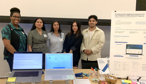 Team of students standing with their project at 2024 Capstone Showcase