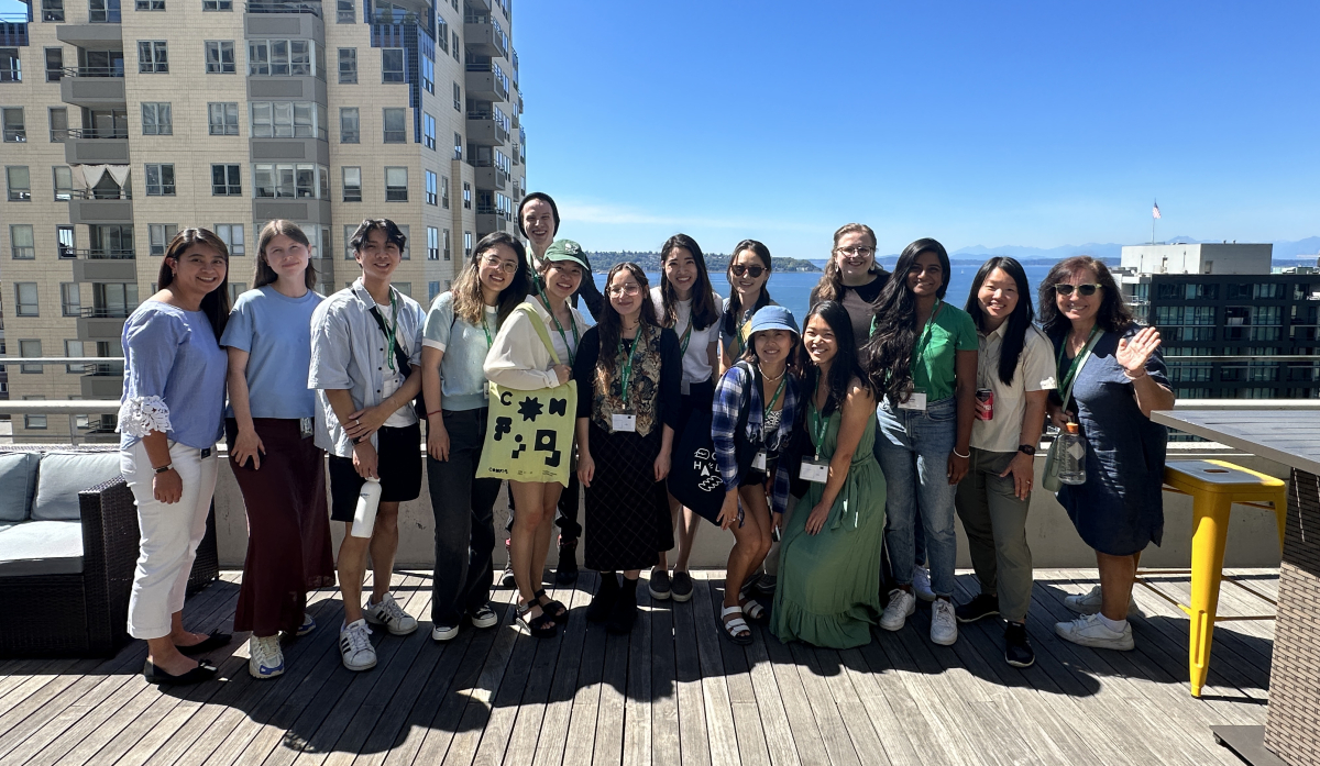 Group of about 20 students on an outdoor deck at Uber Seattle's office